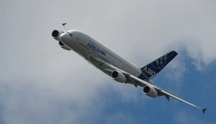 white and blue airliner